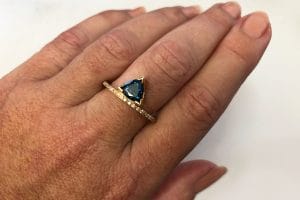 teal trilliant sapphire ring