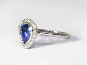 18ct Fairtrade gold with pear sapphire and diamond halo by Zoe Pook Jewellery