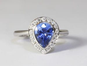 18ct Fairtrade gold with pear sapphire and diamond halo by Zoe Pook Jewellery