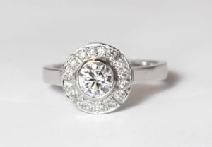 18ct Fairtrade white gold with diamond halo