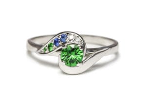 Tsavorite, sapphires, emerald in platinum