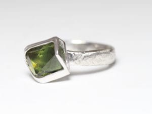 18ct Fairtrade gold with custom cut sapphire by Zoe Pook Jewellery