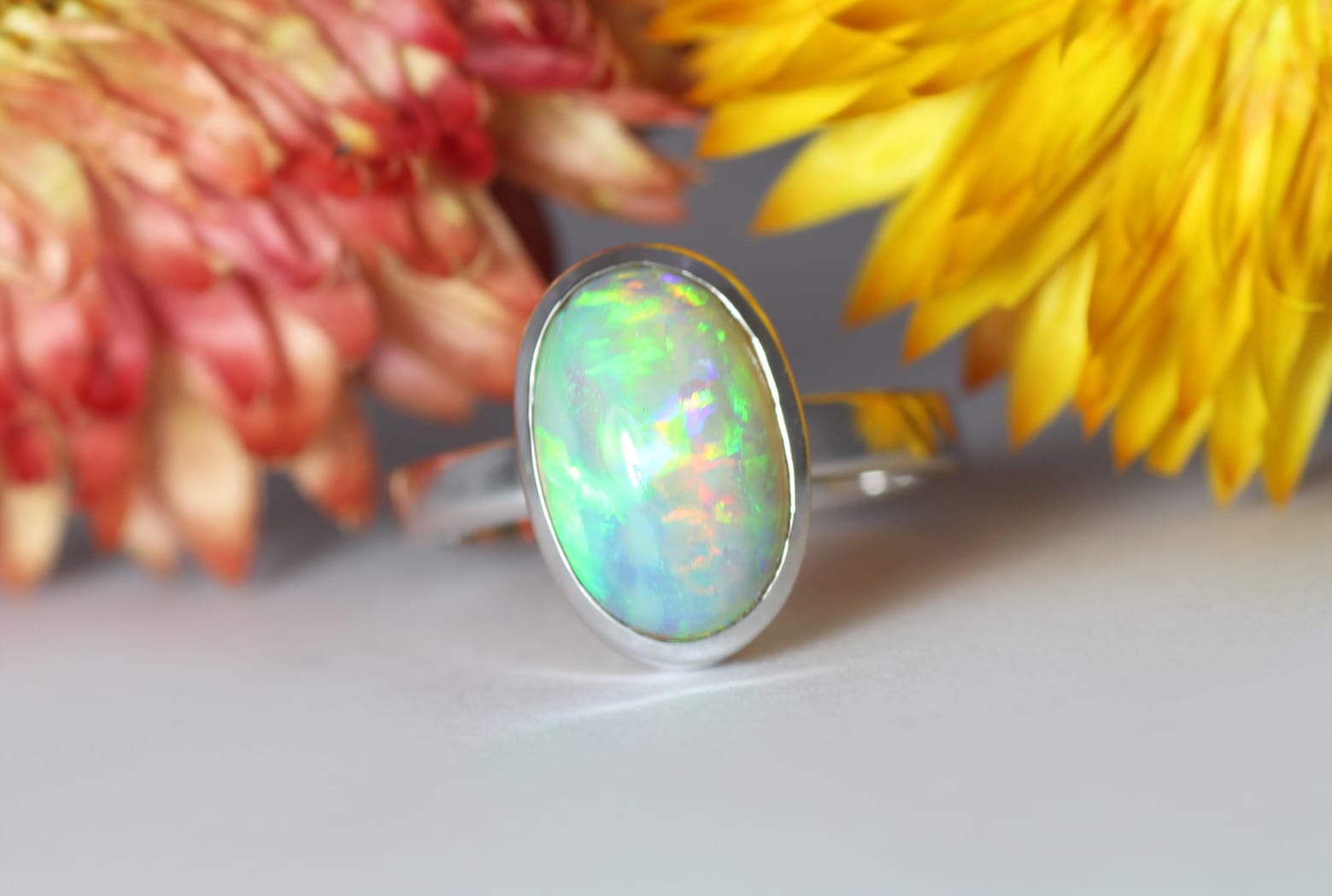 18ct Fairtrade white gold with opal and hidden sapphires