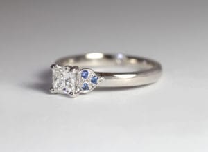 18ct Fairtrade white gold with princess cut diamond and sapphires by Zoe Pook Jewellery