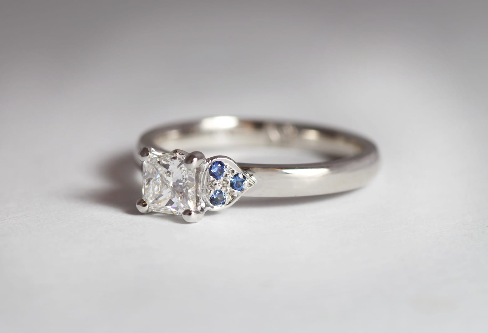 18ct Fairtrade white gold with princess cut diamond and sapphires by Zoe Pook Jewellery