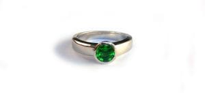 Recycled platinum and tsavorite garnet engagement ring