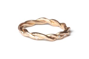 Rose gold twist ring with diamonds