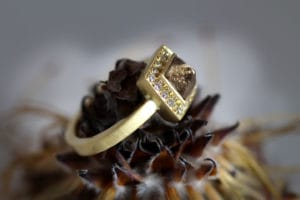 18ct Fairtrade gold with rough diamonds and diamond halo