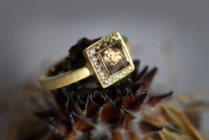 18ct Fairtrade gold with rough diamonds and diamond halo