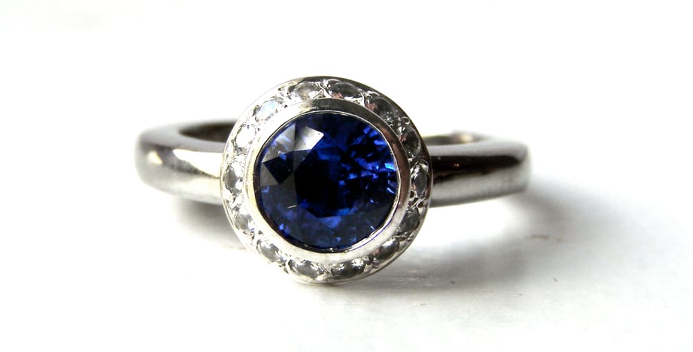 Recycled Platinum Engagement Ring with Small White Sapphire Halo and a Beautiful Ceylon Blue Sapphire