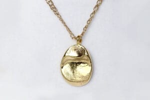 yellow gold pendant with fingerprints