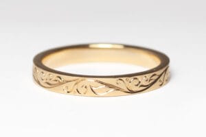 yellow gold ring with hand engraving