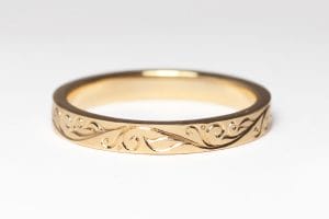 yellow gold ring with hand engraving