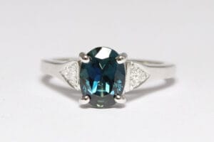 Platinum band with sapphire and diamonds