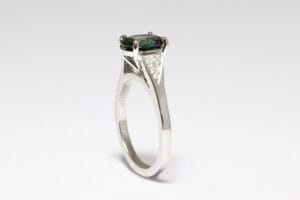 Platinum band with sapphire and diamonds