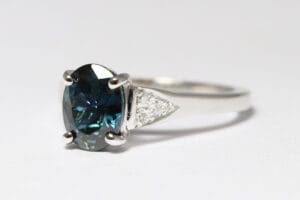 Platinum band with sapphire and diamonds
