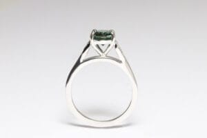 Platinum band with sapphire and diamonds