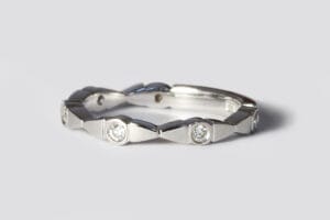 Shaped band with diamonds
