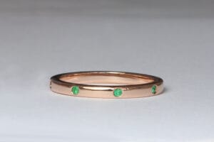 Rose gold wedders with emeralds