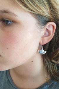 Art Deco silver earrings on model