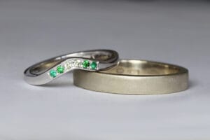 white gold green gems