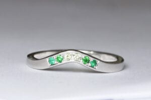 white gold green gems