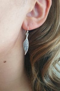 Silver leaf earrings on model