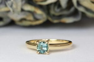 teal sapphire yellow gold