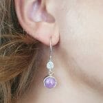 Ruby sapphire earrings on model