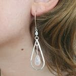 Silver rose quartz earrings on model