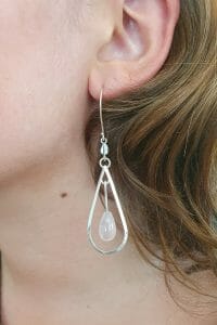 Silver rose quartz earrings on model