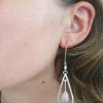 Silver rose quartz earrings on model