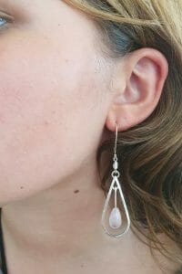 Silver rose quartz earrings on model